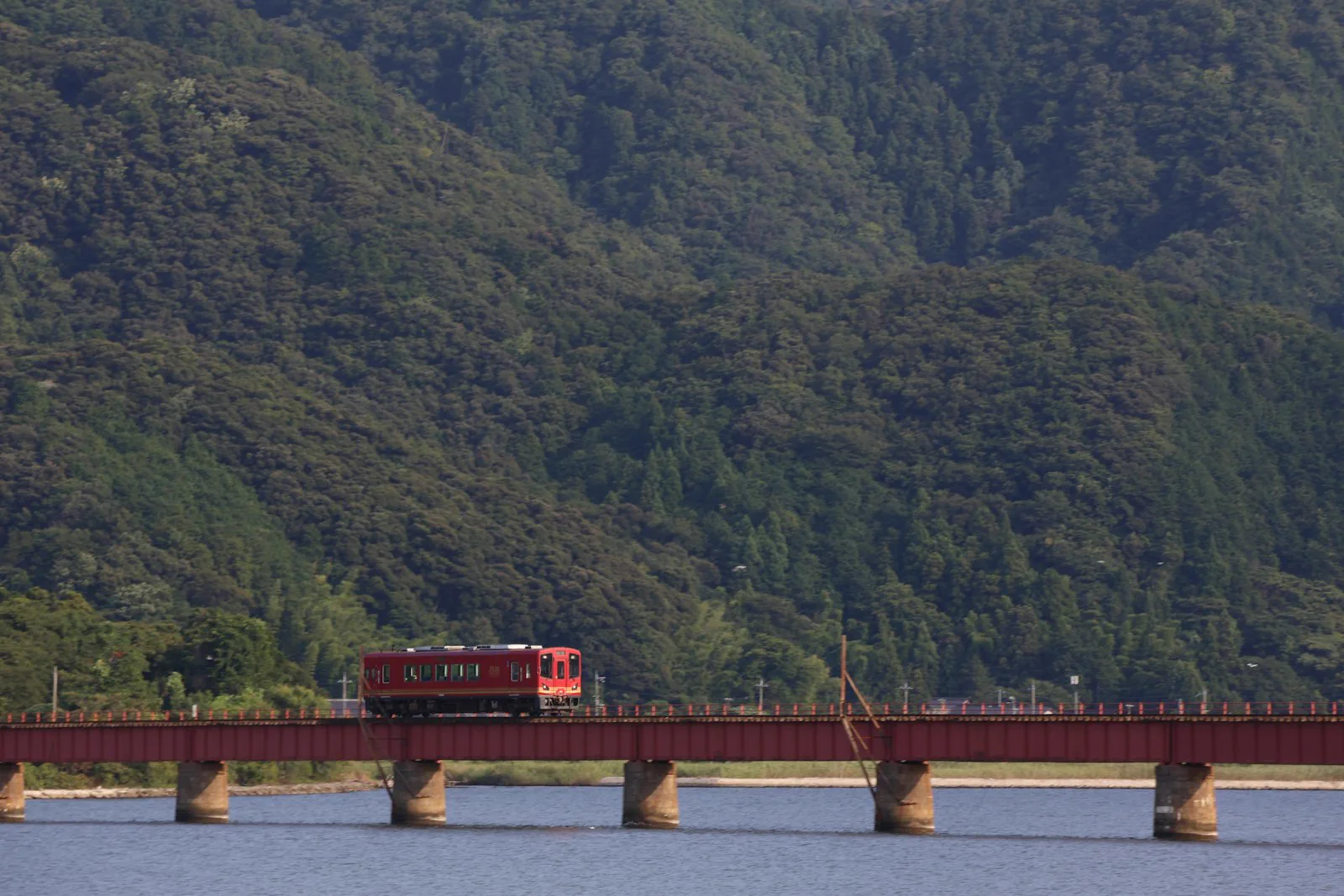Train crossing a bridge over water