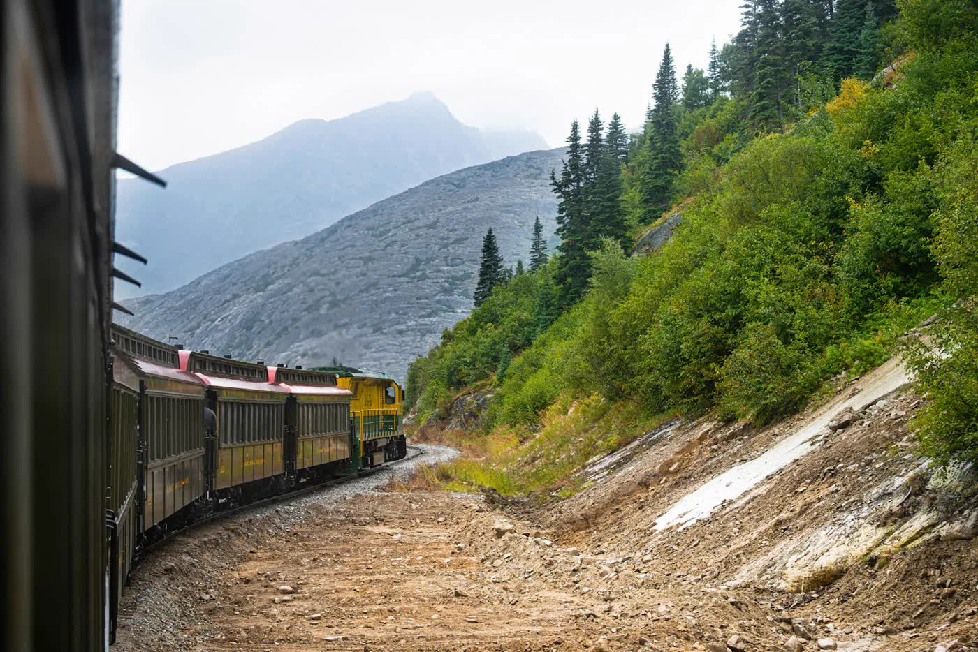 Panoramic train winding through the mountains