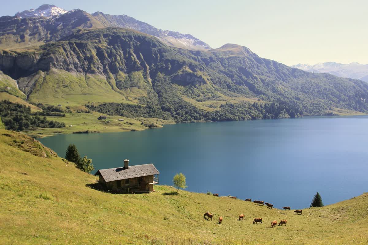 A chalet by an alpine lake in the mountains