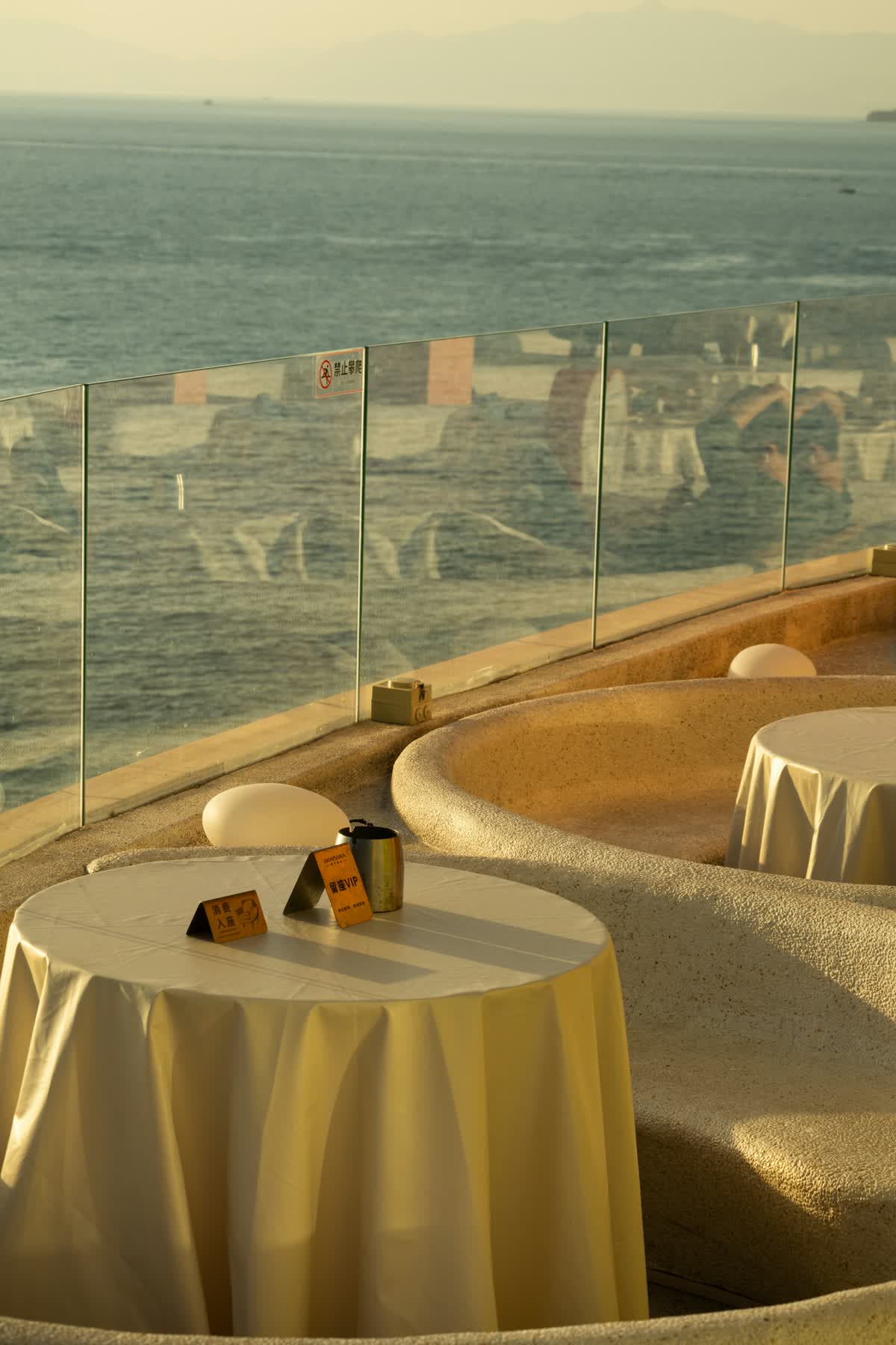 Tables set for dining by the ocean